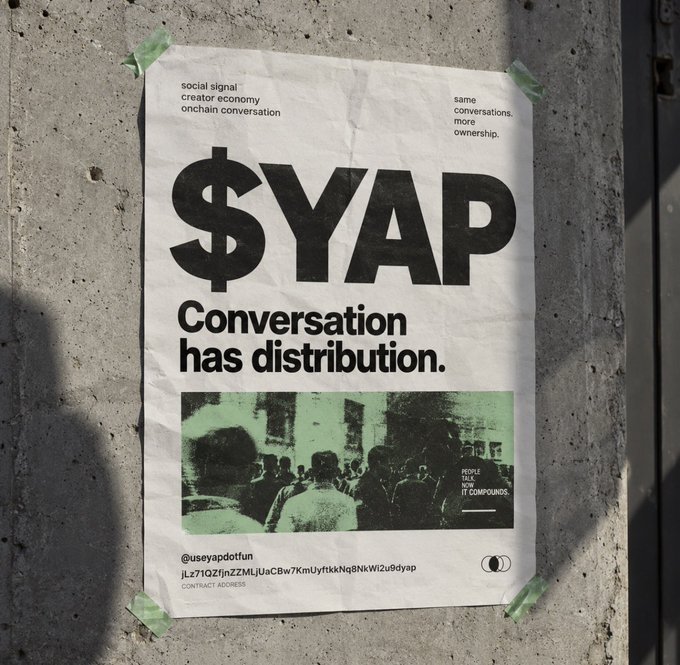 A poster taped to a concrete wall promoting '$YAP' with the tagline 'Conversation has distribution,' referencing social signal, creator economy, and onchain conversation.