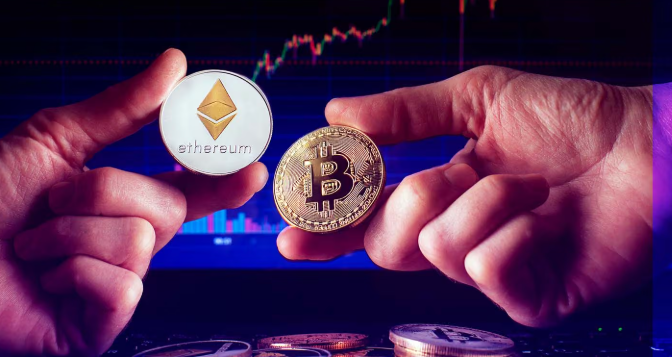 Two hands hold up physical cryptocurrency coins representing Ethereum and Bitcoin against a backdrop of a digital trading chart.