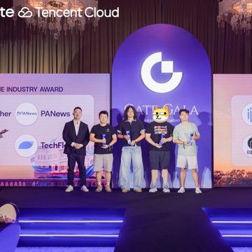 A group of six people stand on stage holding awards at a GateData ceremony sponsored by Tencent Cloud, with logos for PANews, TechFlow, and other partners visible.