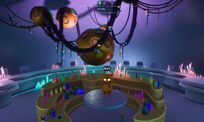 A screenshot from a virtual world game showing a character named 'Balt' standing in a mystical chamber with glowing candles and floating organic structures above.