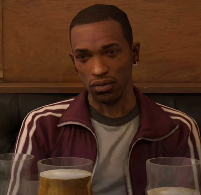 A digital rendering of a man with short hair in a maroon and white track jacket sitting at a table with beer glasses.
