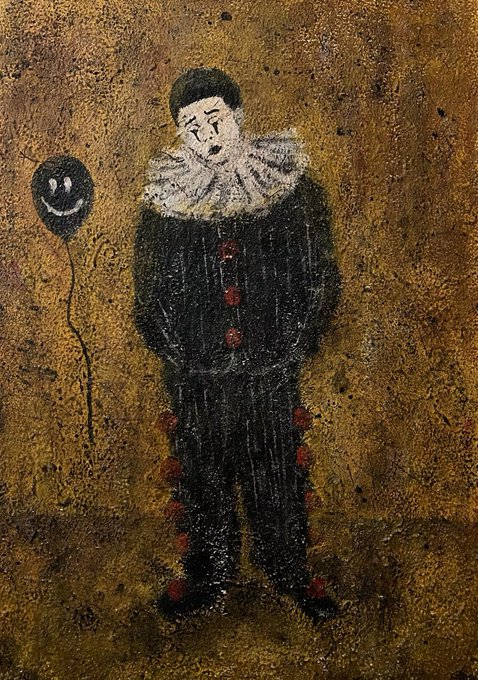 A painting of a sad clown wearing a black ruffled collar and dark outfit with red pom-poms, holding a black balloon with a white smiley face on it, set against a textured golden background.