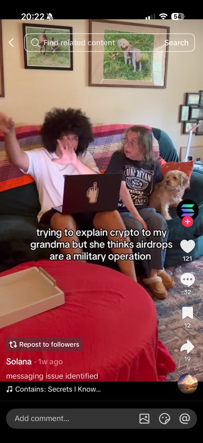 The image shows a TikTok video titled "trying to explain crypto to my grandma but she thinks airdrops are a military operation," featuring two people on a couch with a dog and a laptop, posted by user Solana. The accompanying post's message about "buying series of new tokens will only have you liquidated" and advising to "buy and hold" appears to be using the humor of the video to make a serious point about crypto investment strategy.