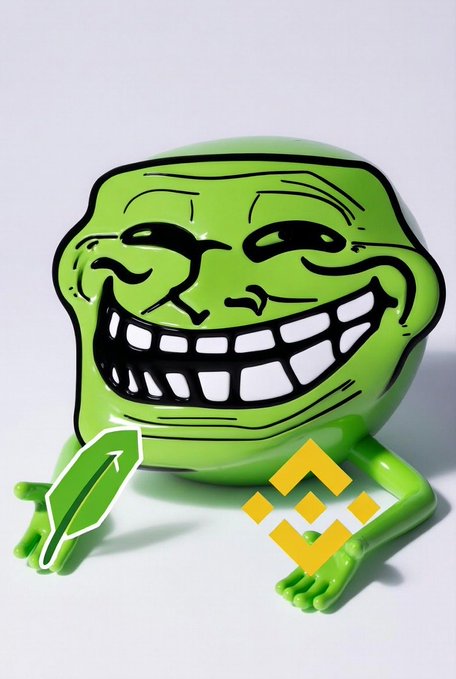 A green, glossy 3D figurine of the 'trollface' meme is shown holding a green object, with a yellow Binance logo hovering in the foreground.