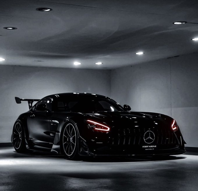 A sleek matte black Mercedes-AMG GT R, enhanced by Robert Hüber AG, sits under dramatic showroom lighting, its aggressive stance and dark finish capturing a rare moment of automotive perfection.

The image's intense, almost reverent presentation of this limited-edition supercar mirrors the post's sentiment—that certain extraordinary moments, like the rare sighting of such a meticulously crafted machine, are fleeting and exceptional.