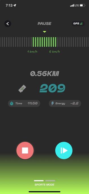 A STEPN GO sports mode screen in PAUSE state, showing 0.56KM distance, 209 tokens earned, 11:50 time, and -2.2 energy.