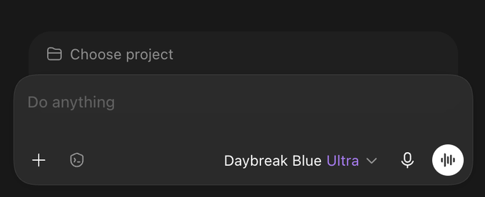 Dark-themed user interface showing a 'Choose project' button above a text input field containing 'Do anything', with a microphone icon and 'Daybreak Blue Ultra' text.