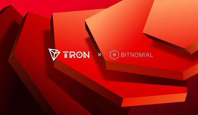 Promotional graphic announcing a partnership between TRON and BITNOMIAL, displayed in white text on a red geometric background.