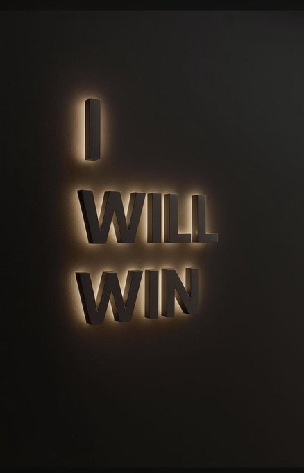 A backlit sign glowing in the dark displays the motivational phrase 'I WILL WIN' in large capital letters.