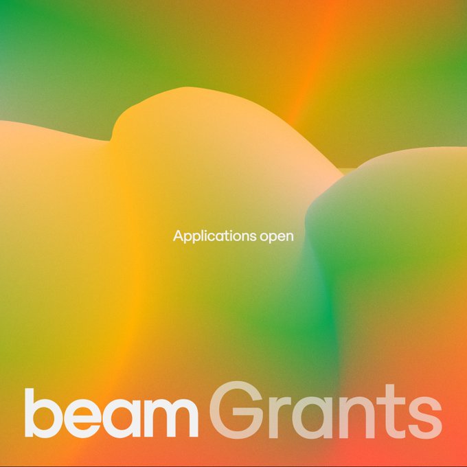 The image features an advertisement for Beam Grants that showcases a colorful background with orange, green, and yellow hues. The text "Applications open" is displayed at the top of the image, indicating that applications are available for funding. The main focus of the image is on the application process, as it highlights how to apply for grants from Beam Grants.