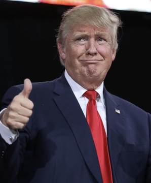 Donald Trump gives a thumbs up while wearing a dark suit and red tie, smiling as he makes an announcement that Ukraine and Russia have agreed to halt attacks on each other's energy targets and identifies the Russia-Ukraine conflict as the primary cause of rising global diesel prices.