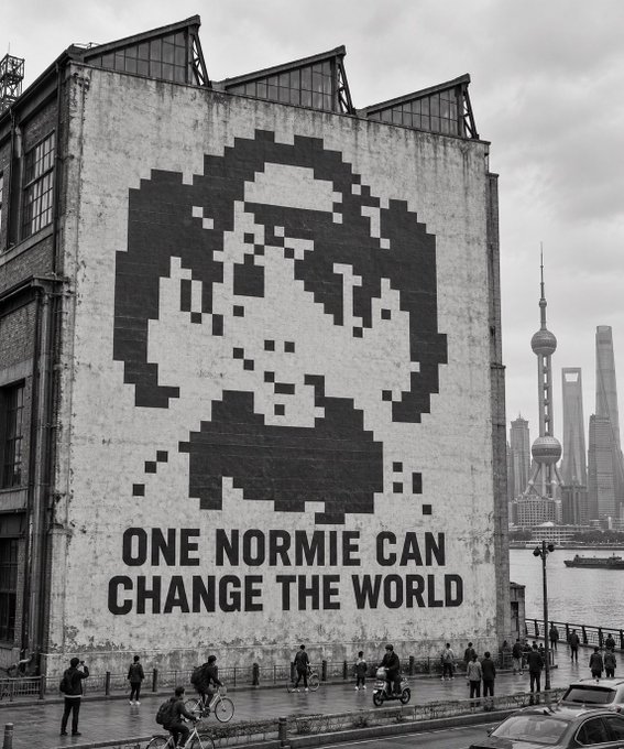 A black-and-white photo of a building mural in Shanghai featuring a pixelated portrait and the text 'ONE NORMIE CAN CHANGE THE WORLD'.
