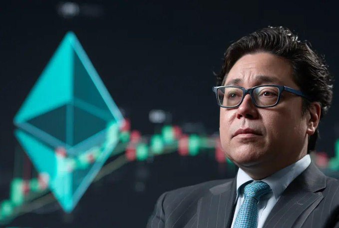 A man in a dark suit, white shirt, and teal tie with glasses stands in front of a digital backdrop displaying the Ethereum logo alongside a candlestick price chart, visually reinforcing the post about Bitmine's growing Ethereum holdings of 6,016,414 ETH valued at $16.4 billion.