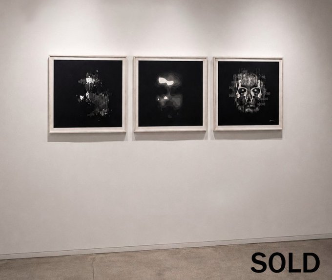 Three framed black-and-white artworks hung on a gallery wall, with the text 'SOLD' displayed in the bottom right corner.