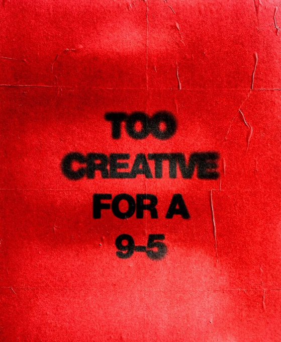 Black spray-painted text on a red poster reads 'TOO CREATIVE FOR A 9-5'.