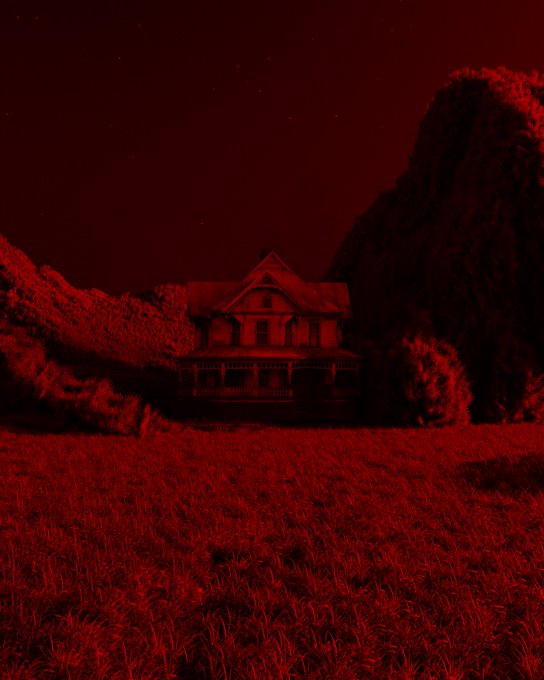 A Victorian-style house sits isolated in a field, bathed entirely in an eerie red light against a dark night sky, evoking a haunting, ominous atmosphere. The monochromatic red filter suggests foreboding or danger, fitting for a post marked "GM" (Good Morning) presented in an unsettling, horror-inspired aesthetic.