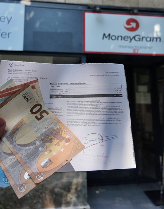 A hand holding a 50 Euro banknote and a MoneyGram receipt in front of a MoneyGram storefront; the receipt shows a transfer reference number and transaction details.