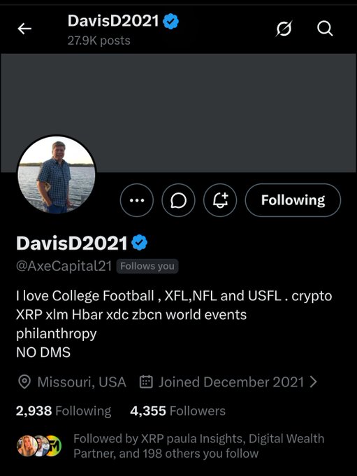 A screenshot of the Twitter/X profile for "DavisD2021" (@AxeCapital21), a verified account based in Missouri, USA, with 27.9k posts and 4,355 followers, featuring a bio that lists interests in College Football, XFL, NFL, USFL, crypto (XRP, XLM, HBAR, XDC, ZBCN), world events, and philanthropy. The image directly corresponds to the post's shoutout, showcasing the profile of the XRP HODLer being highlighted.