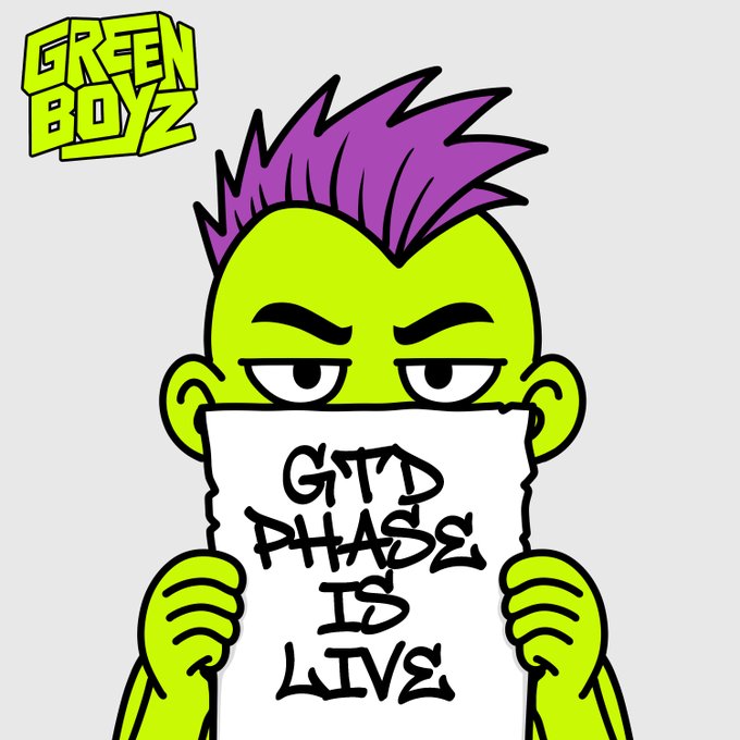 A cartoon character from 'GREEN BOYZ' featuring a green-skinned figure with a purple mohawk holding up a handwritten sign that reads 'GITD PHASE IS LIVE'.