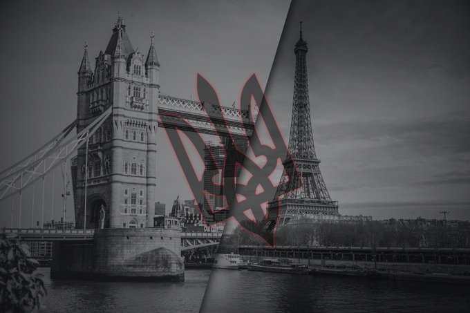 A black-and-white composite shows London’s Tower Bridge and Paris’s Eiffel Tower, split diagonally with a stylized graphic and a visible “Jeez” watermark across the center. The dramatic “two cities” clash reinforces the accompanying post’s exclamation.