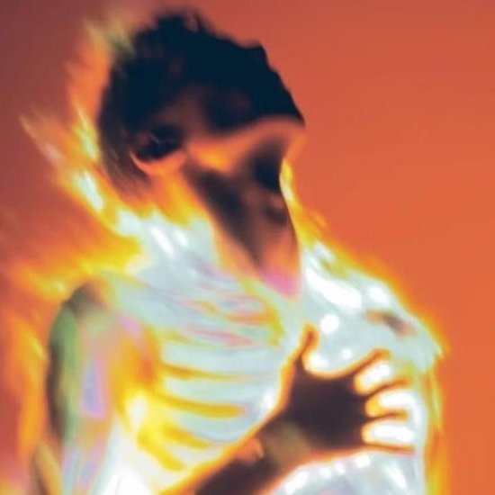 An abstract, colorful image featuring a figure engulfed in flames with orange, yellow, and red hues.