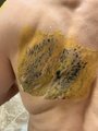 A close-up photo shows a person's hand with a yellow bandage and dark ink staining covering the knuckles, revealing fresh writing or a drawing on the skin that appears to have bled through the adhesive, humorously serving as the "proof" that Marc secretly did something on purpose.