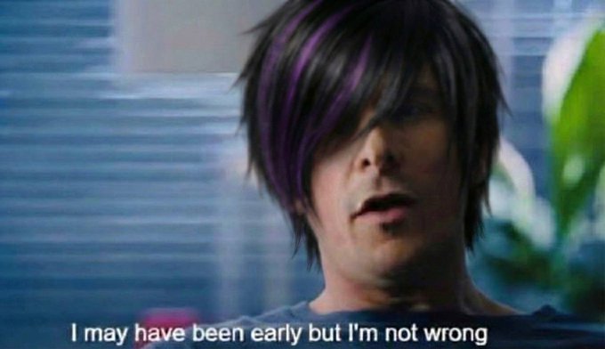 A person with purple-streaked hair is shown in a video screenshot with the subtitle 'I may have been early but I'm not wrong.'