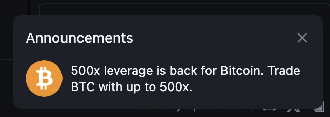 An announcement notification banner reads: '500x leverage is back for Bitcoin. Trade BTC with up to 500x.' next to an orange Bitcoin logo.
