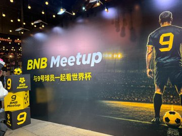 A BNB Meetup event backdrop featuring a soccer player wearing jersey number 9 next to a soccer ball, with Chinese text '与9号球员一起看世界杯' (Watch the World Cup with player #9).