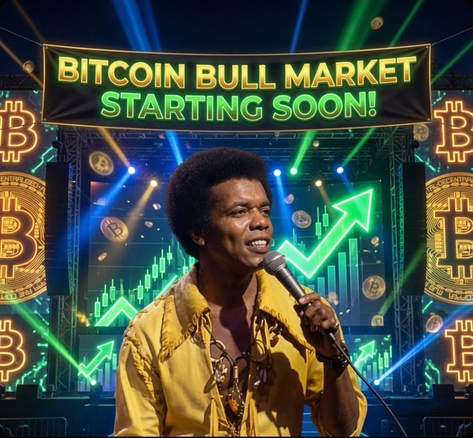 A smiling man with an afro in a yellow fringed shirt holds a microphone on stage beneath a glowing banner reading "BITCOIN BULL MARKET STARTING SOON!" amid green upward arrows and floating Bitcoin coins, visually reinforcing the post's optimistic lyrics about FUD clearing and a bright "Bit-coiny day" ahead.
