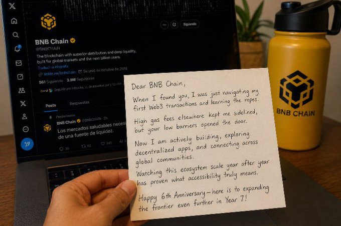 A handwritten letter addressed to BNB Chain celebrating their 6th anniversary, held in front of a laptop displaying the BNB Chain X/Twitter profile and a yellow BNB Chain water bottle.