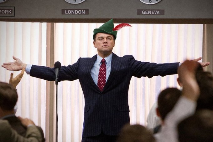 The image shows Leonardo DiCaprio in character as Jordan Belfort from "The Wolf of Wall Street," wearing a green Robin Hood-style hat with a red feather while addressing an audience with arms outstretched, standing in front of signs labeled "LONDON" and "GENEVA." The accompanying post humorously applies this iconic "dismissive/conquering" pose to the Solana memecoin community, suggesting that while Dogecoin-style maximalists focus on one figure, Solana memecoin traders are unfazed by larger players dumping significant sums, essentially mocking the impact of major sell-offs on the ecosystem.