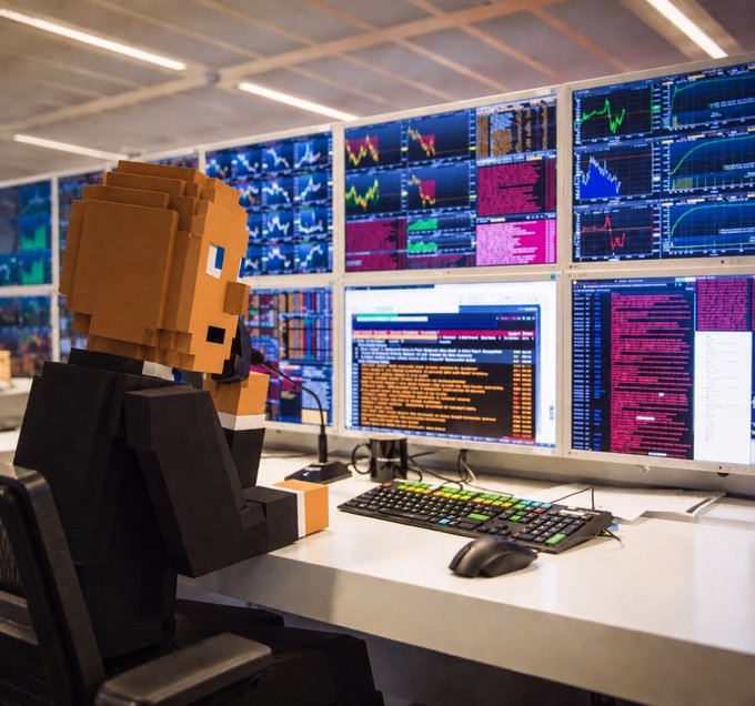 A pixelated cardboard figure sits at a trading desk lined with multiple monitors displaying colorful charts, graphs, and scrolling code or data feeds. The scene humorously brings to life the "Clocking in and monitoring the situation" caption, depicting a low-tech character keeping watch over a high-tech financial or analytics workspace.