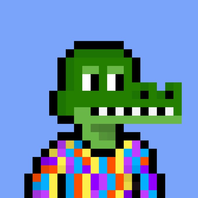 A pixel-art portrait of a green crocodile character with a long snout, wearing a colorful patchwork shirt against a light blue background.