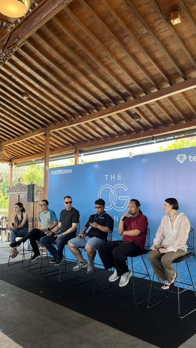 Six panelists sit on stools at a branded stage during "The OG Brunch," with the backdrop displaying "INDODAX" and "THE OG" branding, illustrating an institutional discussion on tokenization, RWAs, and digital markets.