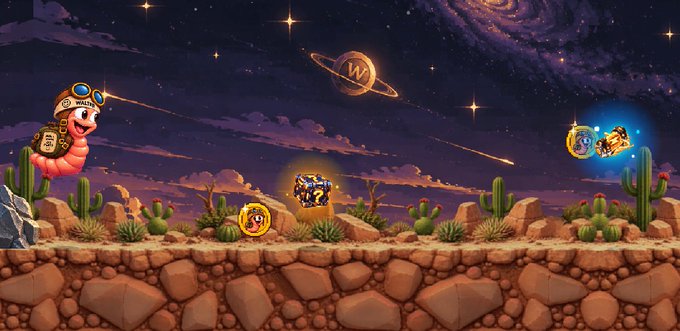 Pixel art desert scene with a starry night sky featuring a Saturn-like planet with a 'W' logo. A worm wearing goggles, treasure chests, and golden coin characters are scattered across the cactus-filled landscape.