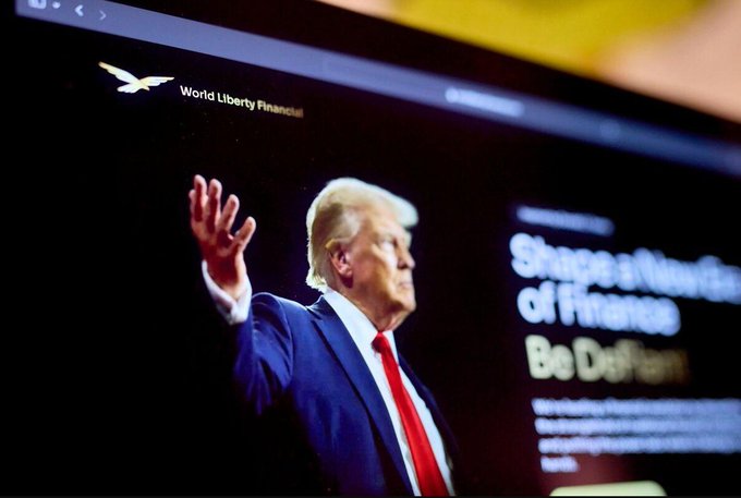 Donald Trump is shown speaking at a podium with a 'World Liberty Financial' eagle logo and the text 'Shape a New Era of Finance, Be DeFi' on the screen behind him.