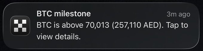 A BTC price notification displays that Bitcoin has surpassed $70,013 (257,110 AED), aligning with the post's excitement about an emerging bull run and its promotional call to trade on OKX.