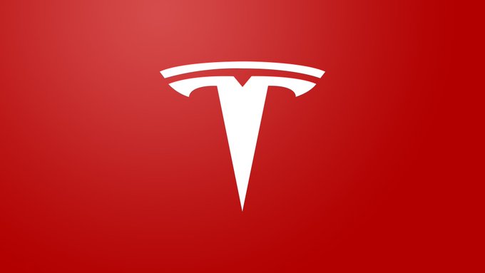 The white Tesla 'T' logo centered on a red gradient background.