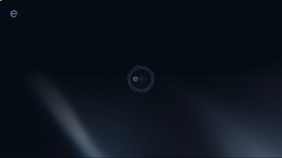 A post is displayed that includes an illustration of a black circular logo with the word "monero" written inside the circle. The background appears to be mostly black, but there are some white areas scattered throughout. Additionally, there is another caption above the main one stating that a new trade for @monero has been made at $335 and it has a high probability of success.