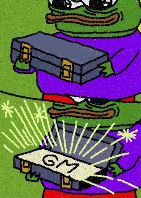 The meme shows Pepe the Frog in two panels: first holding a closed briefcase, then opening it to reveal a glowing "GM" (good morning) inside, visually delivering the cheerful "gm frens of Zaza" greeting.
