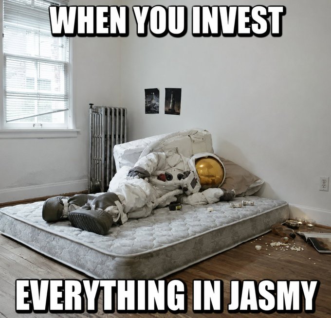 The image features a mattress with an astronaut suit on top of it, suggesting that someone has been pretending to be an astronaut while lying down on the bed. The caption reads "When you invest everything in Jasmy", which implies that the person who took the photo is making a joke about investing all their time and energy into something or someone else, like the astronaut in the suit.