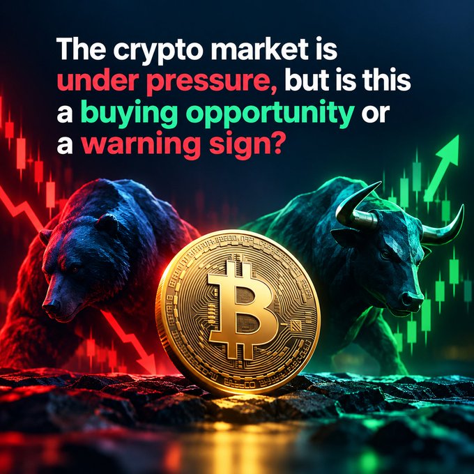 A crypto market graphic featuring a golden Bitcoin coin centered between a red-lit bear on the left and a green-lit bull on the right, with text questioning whether the market downturn is a buying opportunity or warning sign.