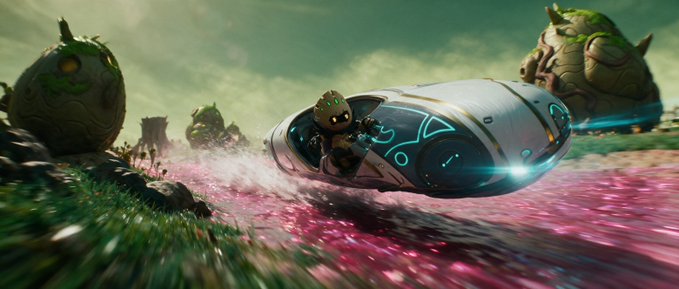 A science fiction scene showing a small alien character driving a sleek futuristic vehicle through a field of pink flowers, surrounded by large rock-like creatures.