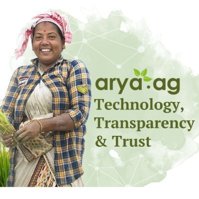 Promotional image for 'arya.ag' featuring a smiling farmer holding crops alongside the text 'Technology, Transparency & Trust'.