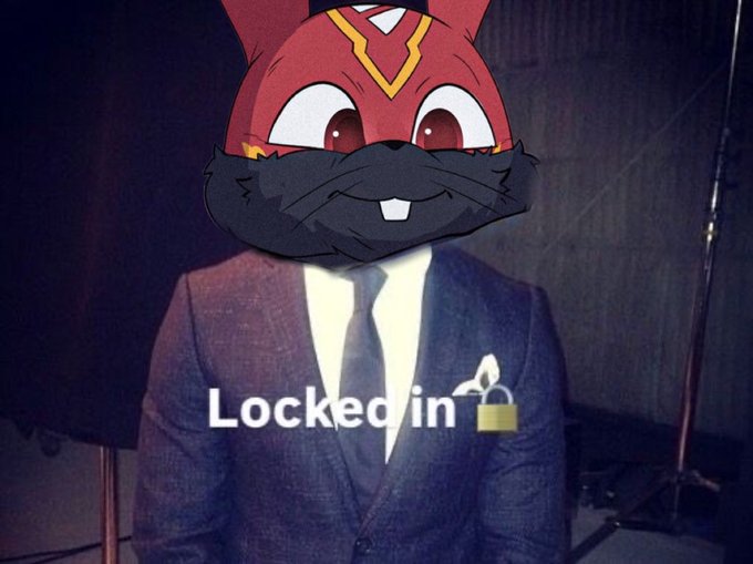 A cartoon red rabbit mascot in a suit is overlaid on a person in a suit, with the text "Locked in" and a lock emoji displayed across the image. The image humorously represents the intense focus and dedication needed for the AVAX "summer," tying into the post's hype for an upcoming release.