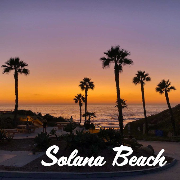 A coastal sunset scene with silhouetted palm trees overlooking the ocean is overlaid with the text "Solana Beach." The image visually plays on the wordplay of "Solana" sounding like "sun," tying into the post's "Solana Summer" theme by evoking warm, sunny beach vibes associated with the Solana cryptocurrency brand.