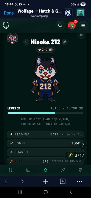 The image shows a cell phone screen with an app called Wolfage, which is used for gaming purposes. The main focus of the image is a character named Hisoka, who is leveling up his HP. The character's HP value currently stands at 4L, and he needs to reach a total of 1,155 XP points before he can level up. The game description also mentions that the character has "shards" and "food" available for him in the game.