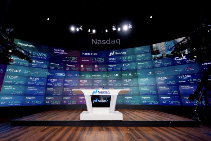 The empty Nasdaq studio stage features digital ticker displays showing market indices like the Dow Jones (+0.65%), Nasdaq Composite (+1.13%), Nasdaq 100 (+1.22%), and S&P 500 (+0.90%), alongside a central podium branded with the Nasdaq logo. The image connects to the post by suggesting the $SIVE stock may soon generate excitement, or "goosebumps," as investors await a potential surge similar to the day's notable market gains.