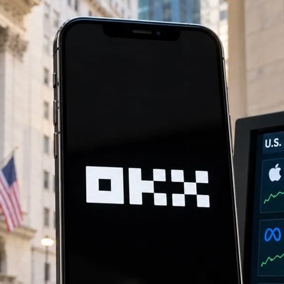 A smartphone screen displays the OKX logo, shown in white against a black background, with an American flag and a building visible in the blurred background.
